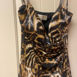 Animal print top by Janice of London. This gorgeous top has a rhinestone buckle.